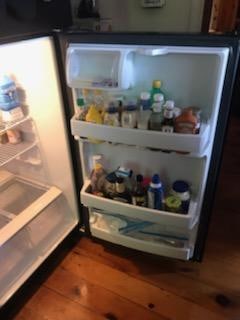 Full refrigerator with nasty opened food 