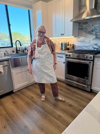 Big sink, nice dishwasher, and a nice gas stove with a great view out the window.