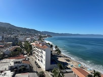 View down the beach from the rooftop pool.