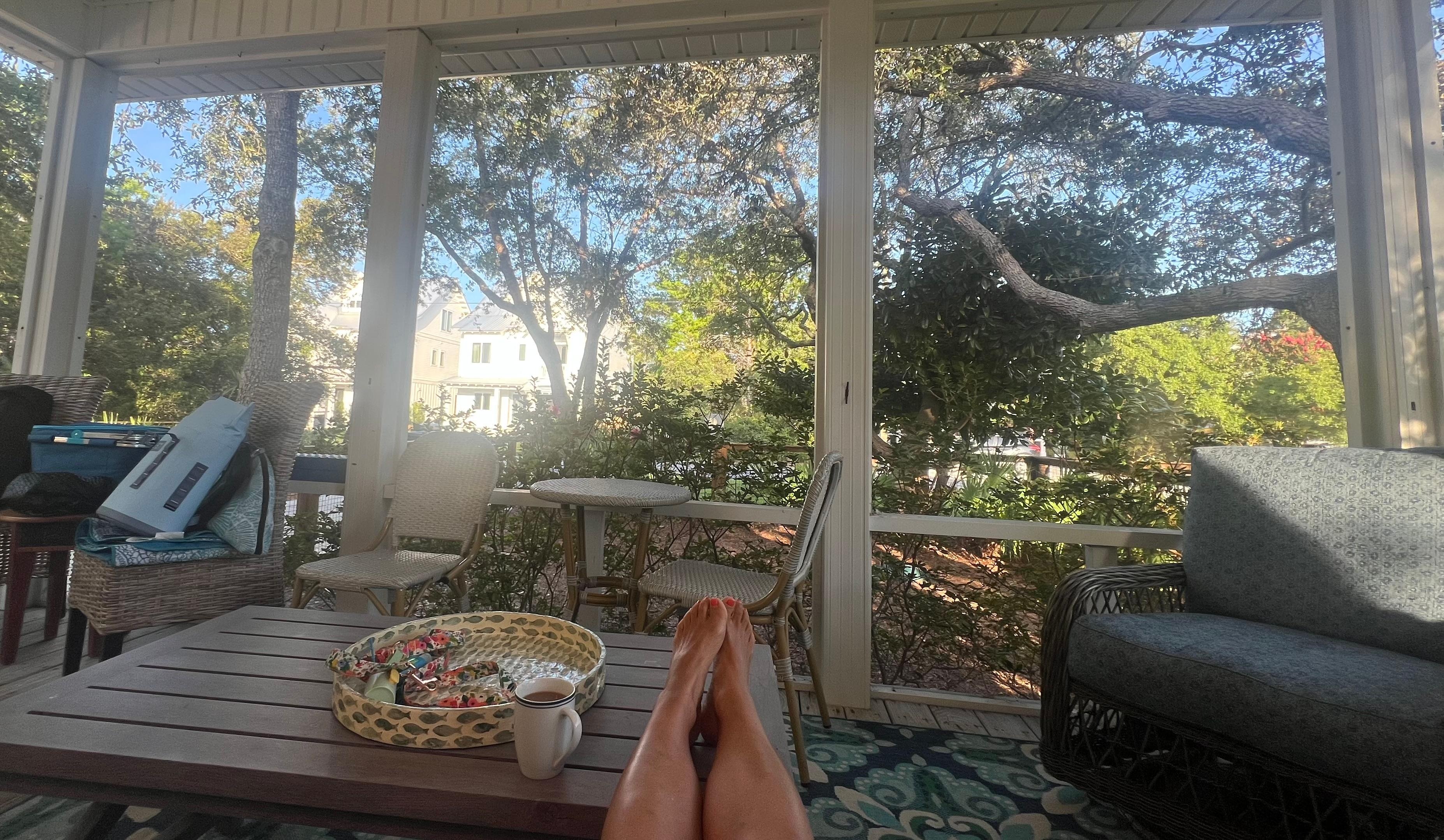 Screened in front porch perfect for your morning cup of coffee.