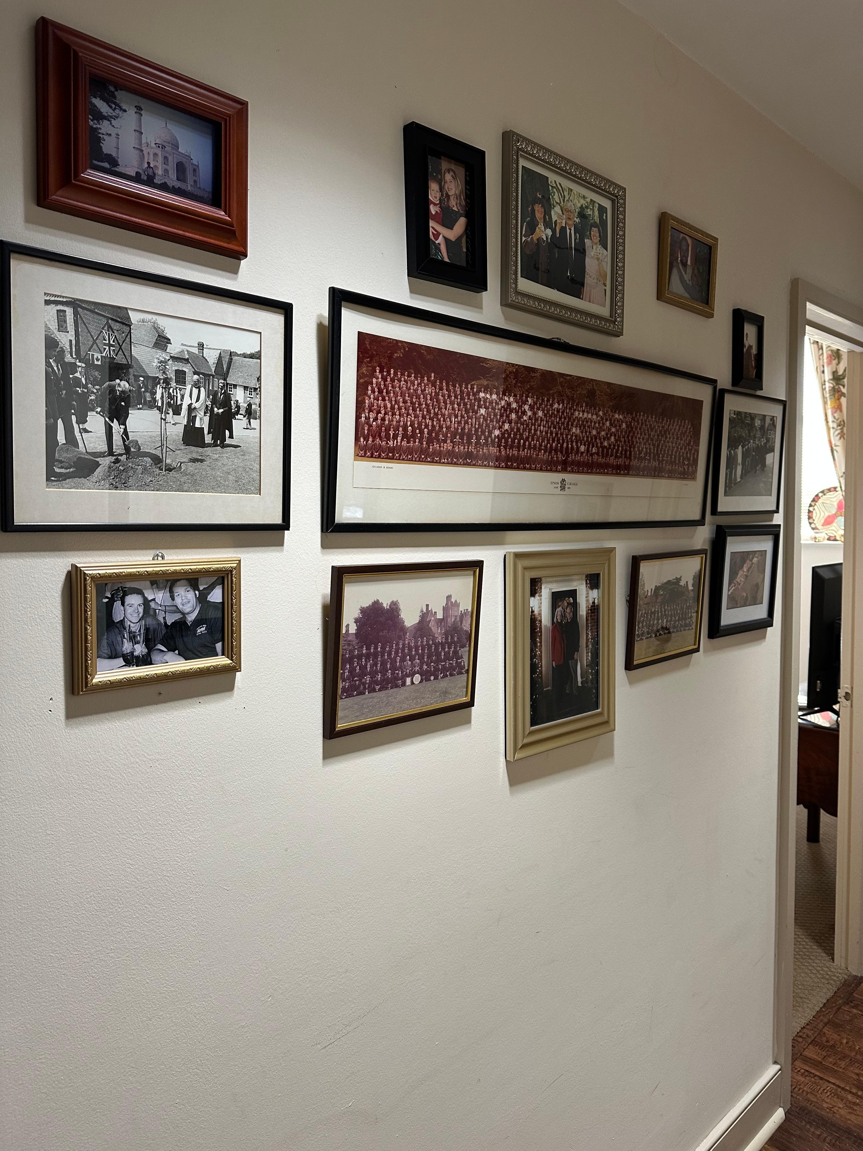 Beautiful photos in entry hall of king/ bath and queen/bath wing of apartment