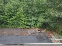 Back area with metal chairs and firepit