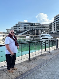 DH with hotel in the background.