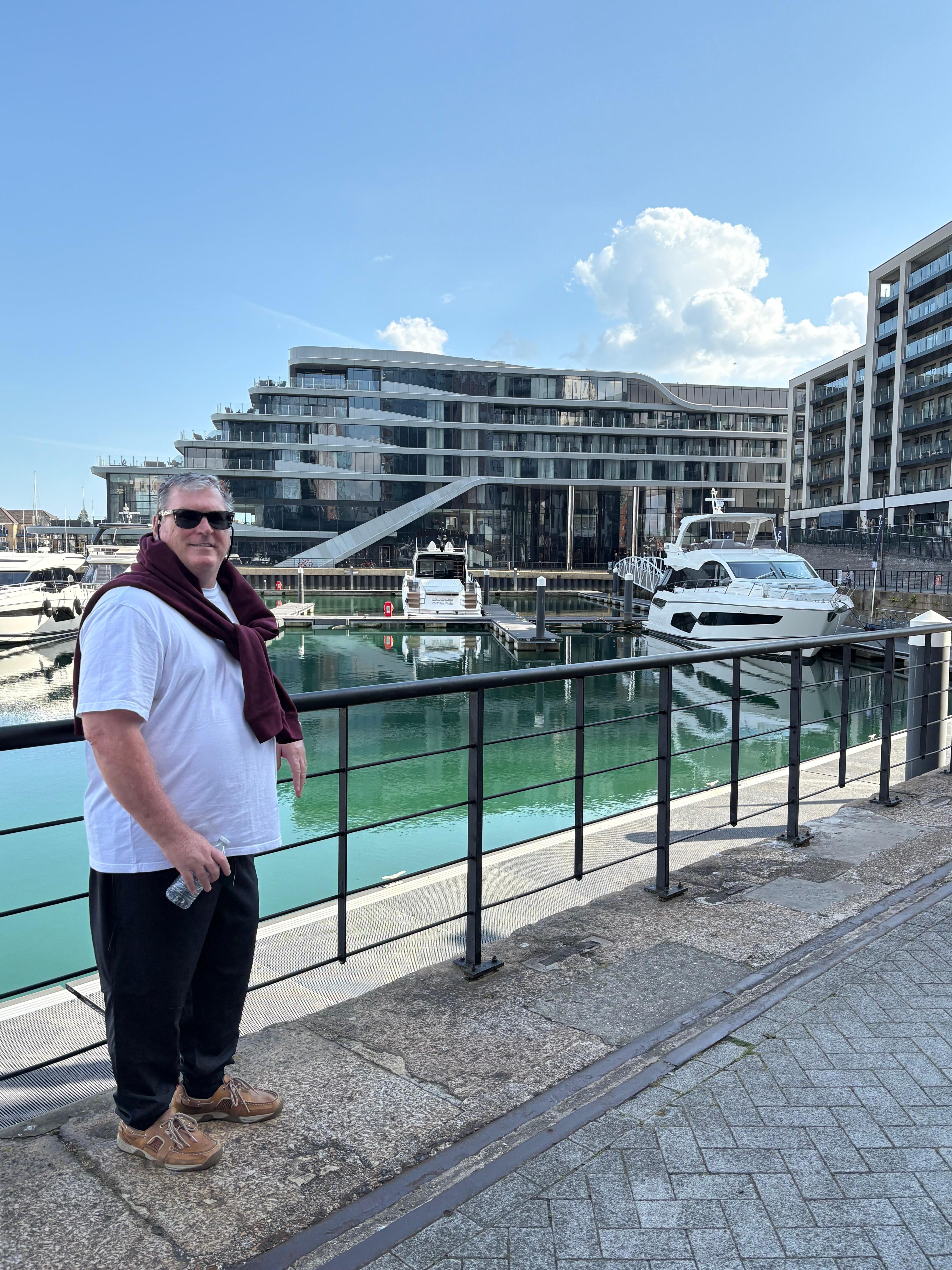DH with hotel in the background.