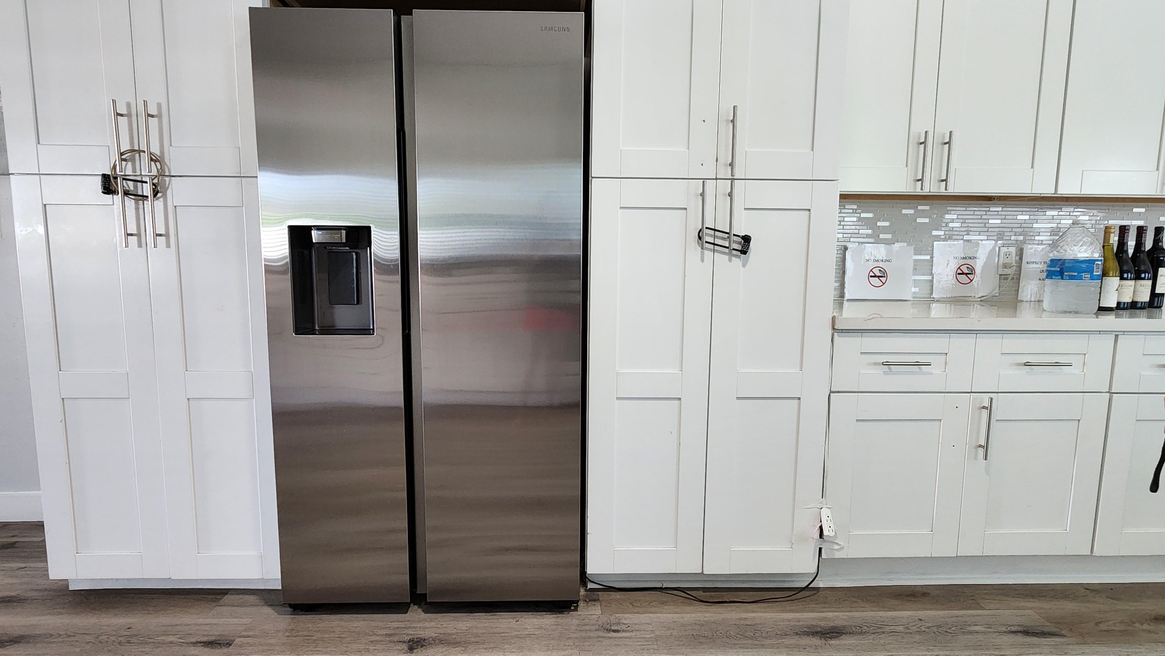Refrigerator connected to power w/ 2 extension cords and missing hardware on cabinets.  This is a fire hazard.