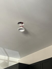 Light fixture in kitchen hanging out from ceiling