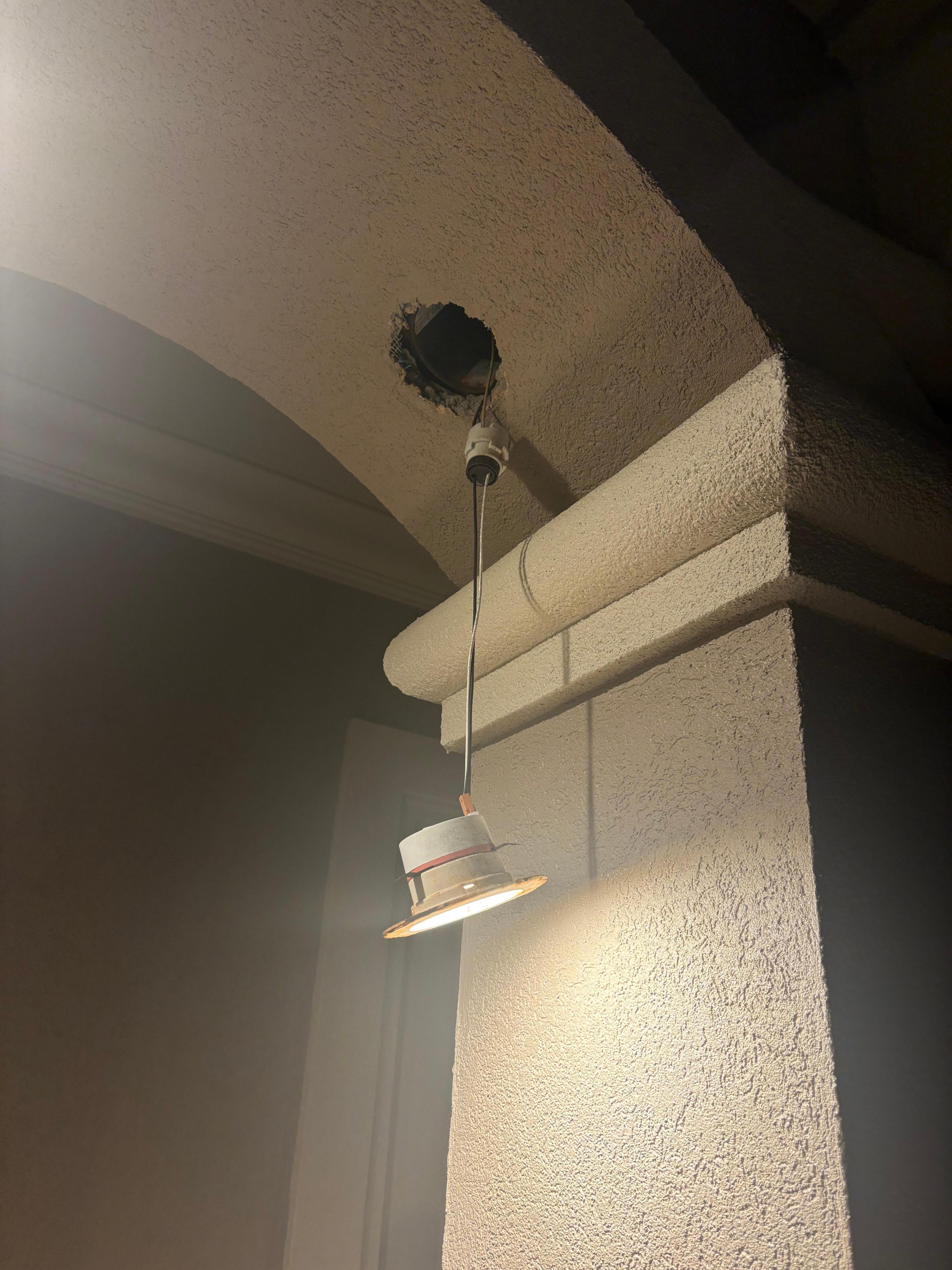 Light fixtures hanging from the ceilings. 