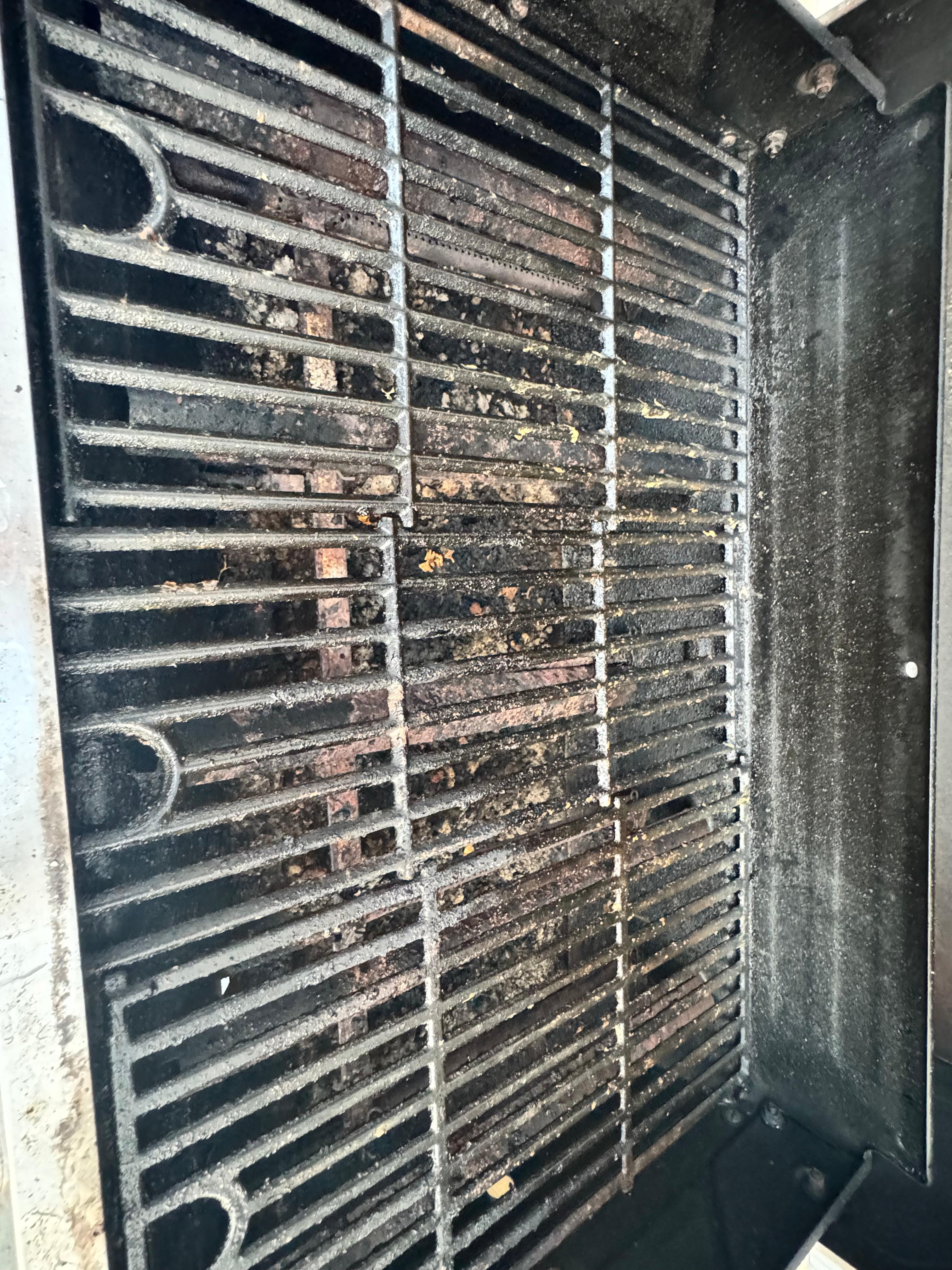 Grill left with old food on it