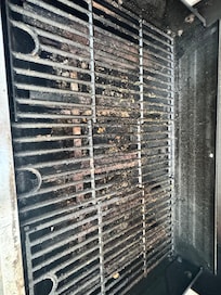 Grill left with old food on it