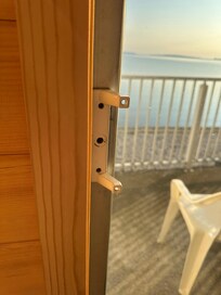 The handle on sliding glass door was broken, making it difficult to open door. The screen was torn on the top and bottom which prevented the door to be open to enjoy the fresh air from the lake.