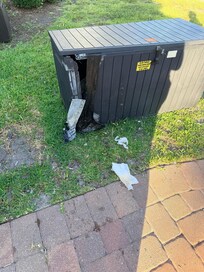Broken trash can. Bags inside were ripped open by something overnight.