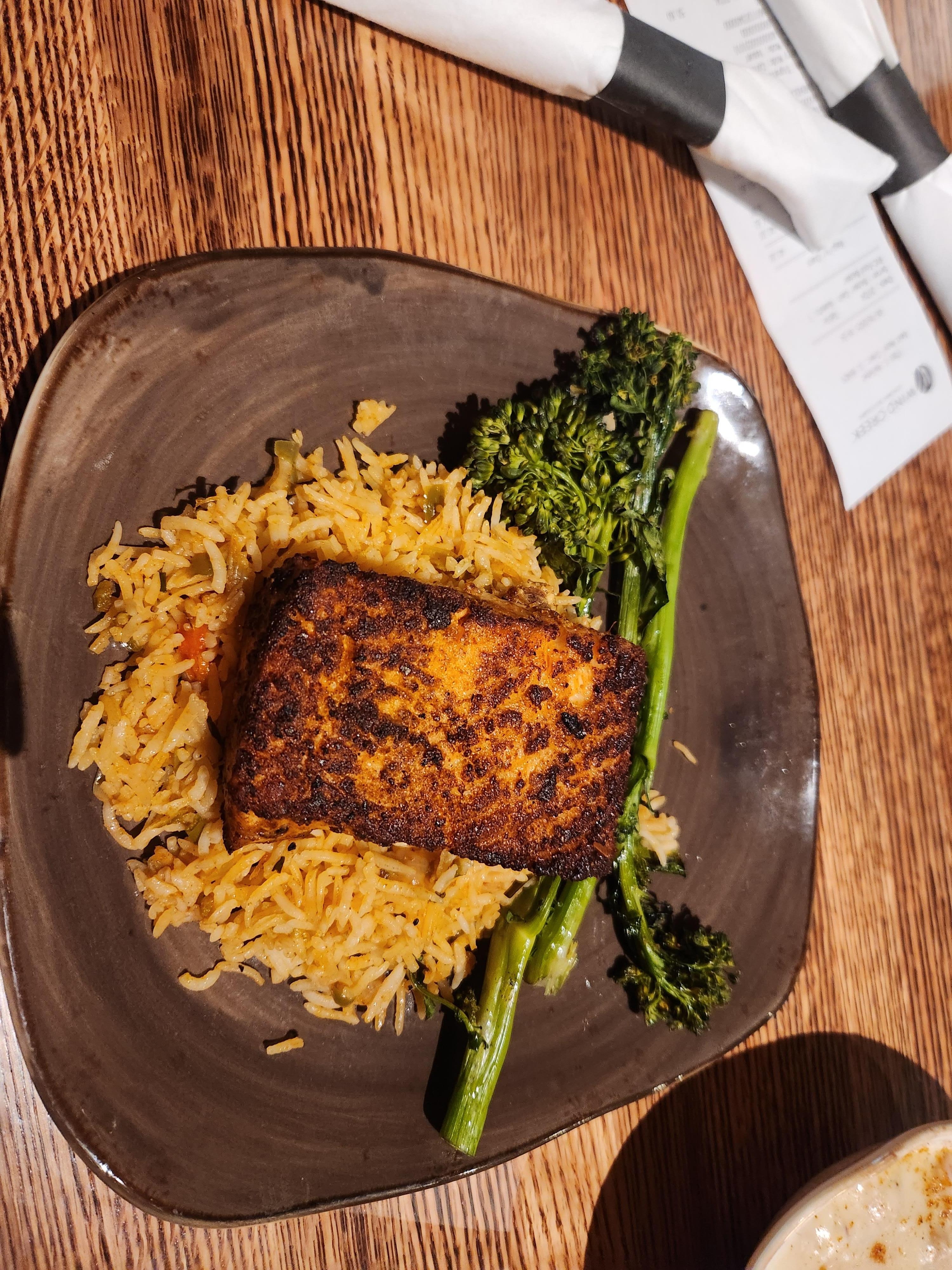 Salmon with rice and broccoli.