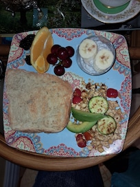 Tofu scramble, Chia vanilla pudding with a touch of cinnamon and banana, fresh fruit, artisan baked bread toast.
