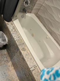 Tub difficult to get into. Good water pressure. Shower curtain moves too much.