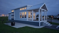A few of the cottage. The Three stacked windows on the left side provide ventilation for the two bunk beds and the loft.