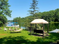 covered swing at the fishing dock, near the fire pit