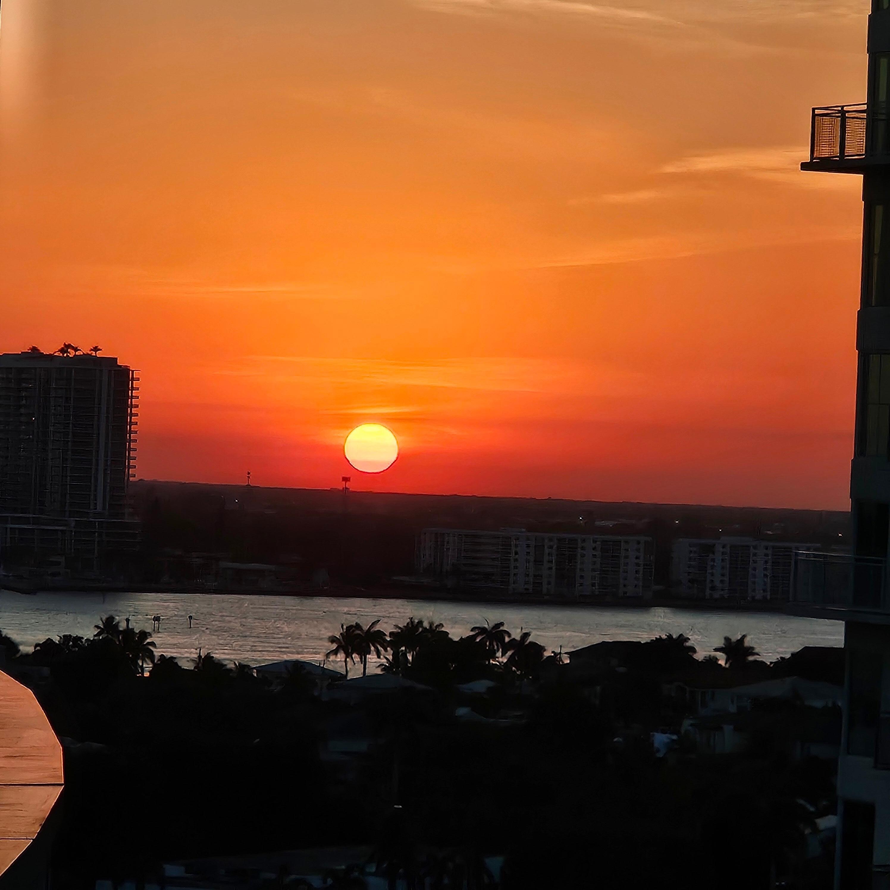 View of the sunset on the harbor from our balcony