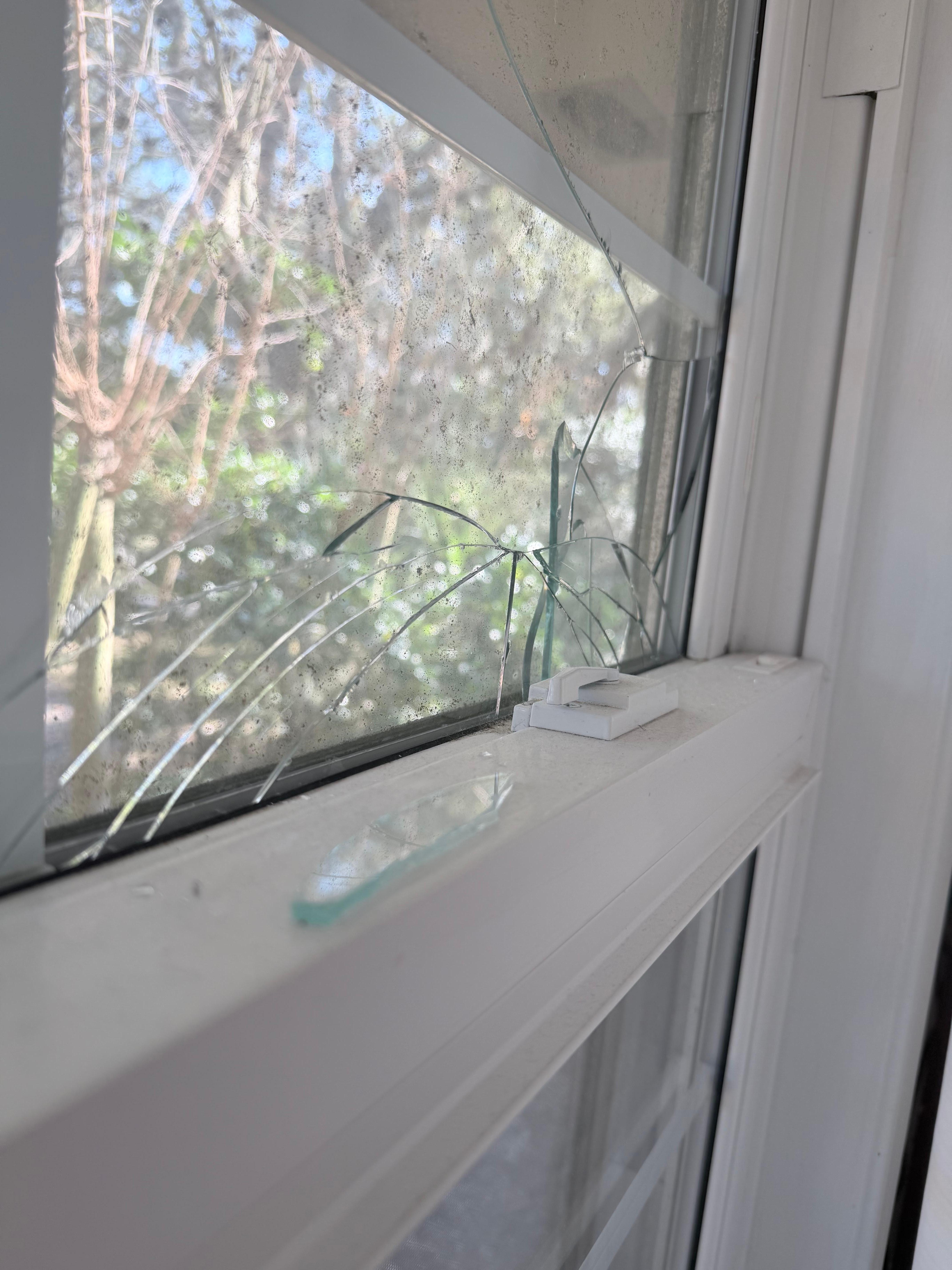 Glass from broken window in bedroom. 