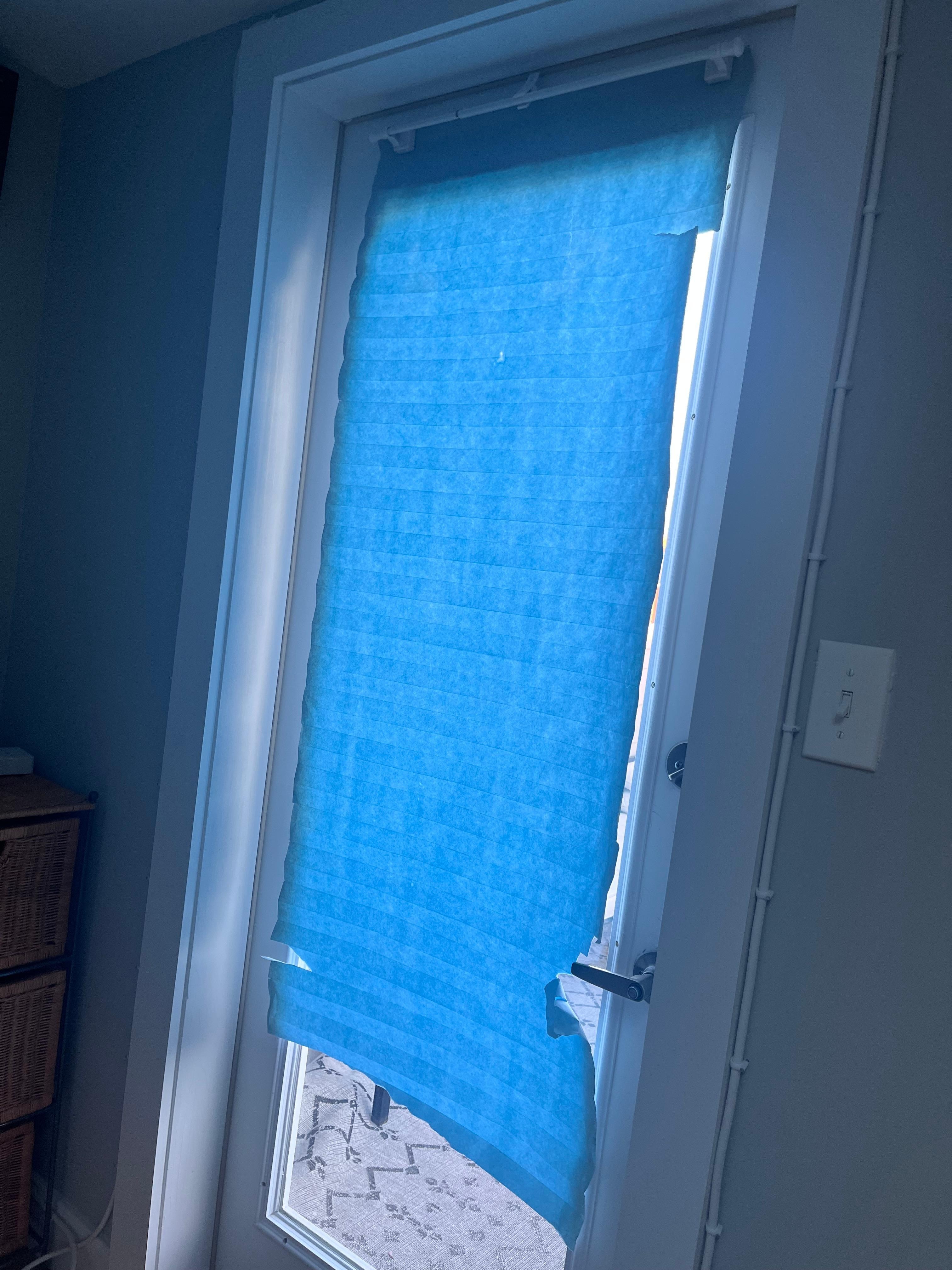 Blind at door to rooftop 