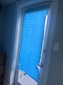 Blind at door to rooftop