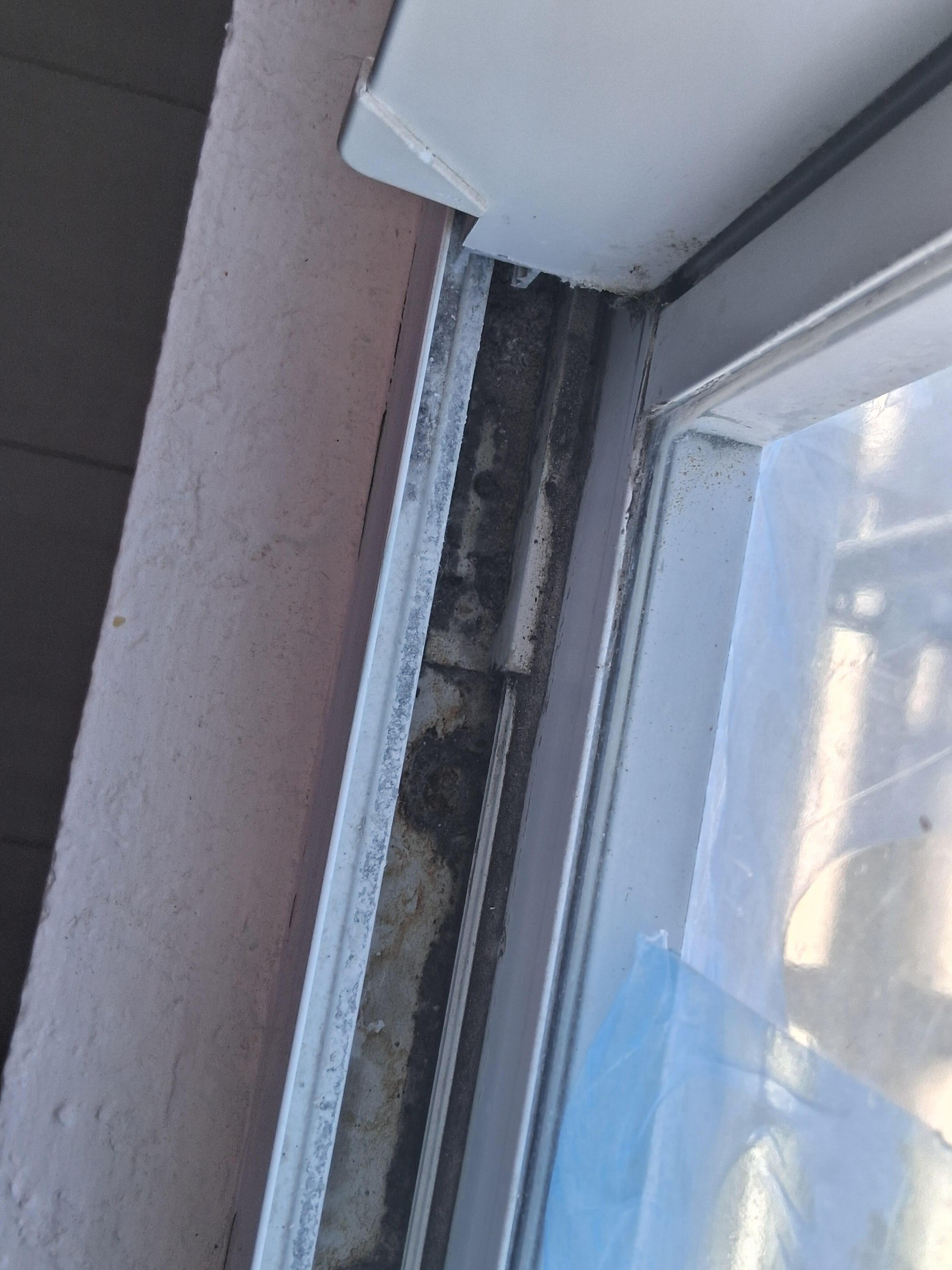 dirt on  window sill.
