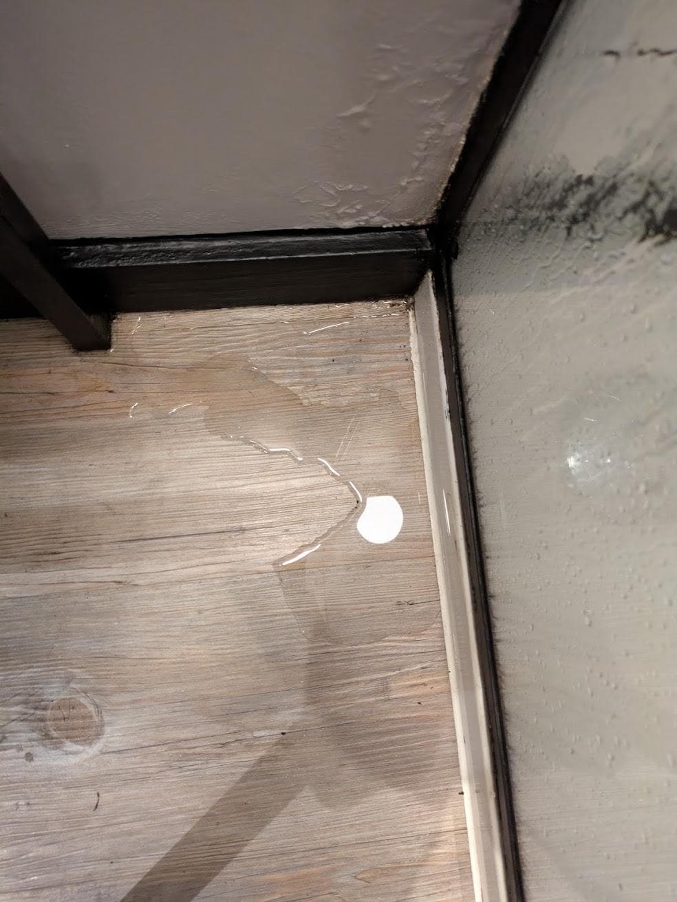 Bathroom filled with water from shower