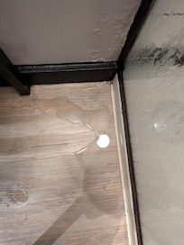 Bathroom filled with water from shower