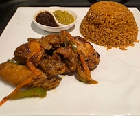 Room service jollof rice and chicken wings