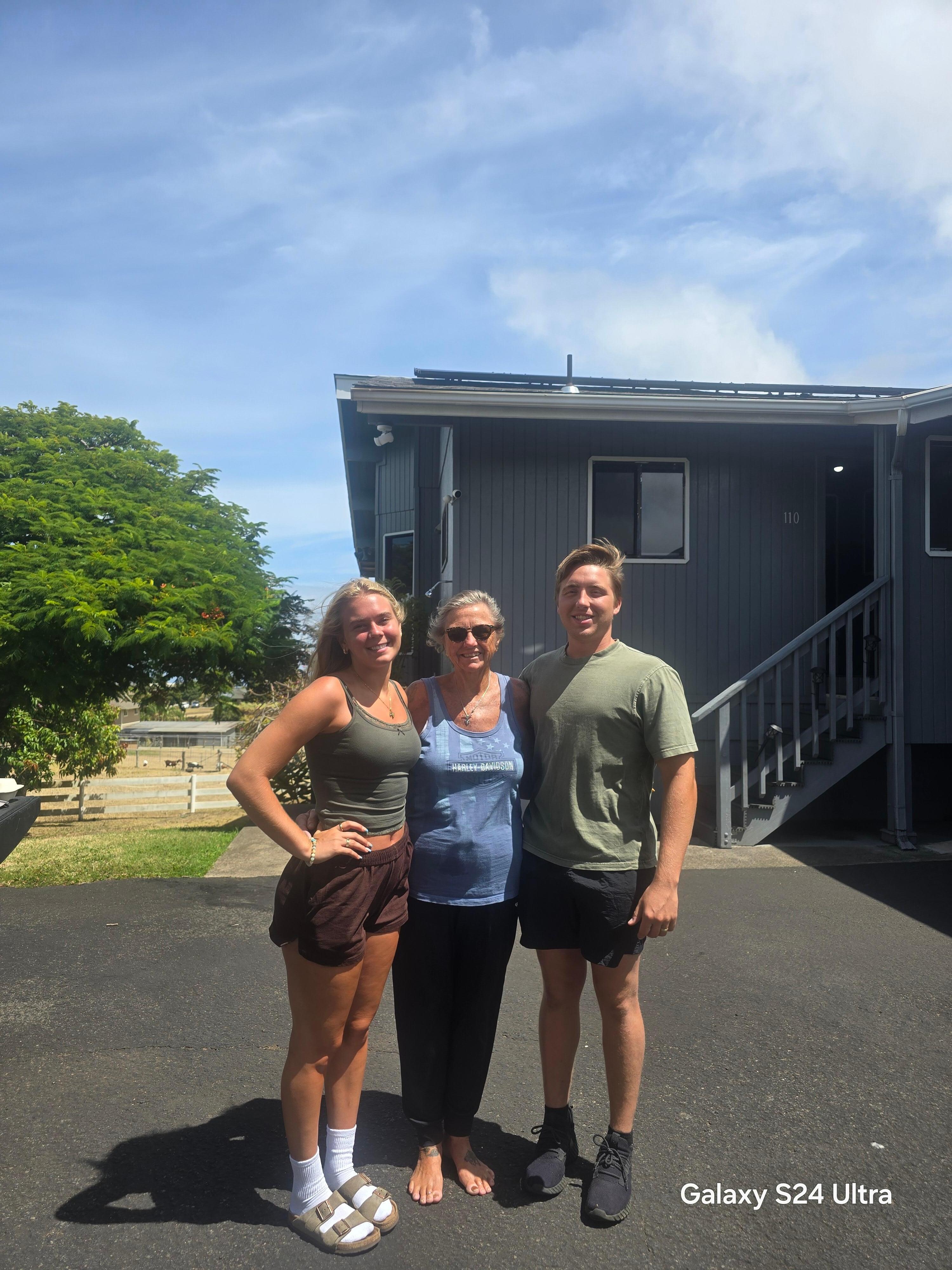 Me and grandkids in front of house