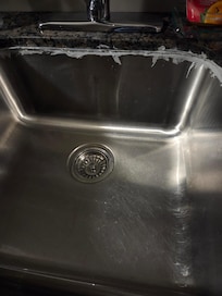 The sink was siliconed by a toddler from the looks of it.