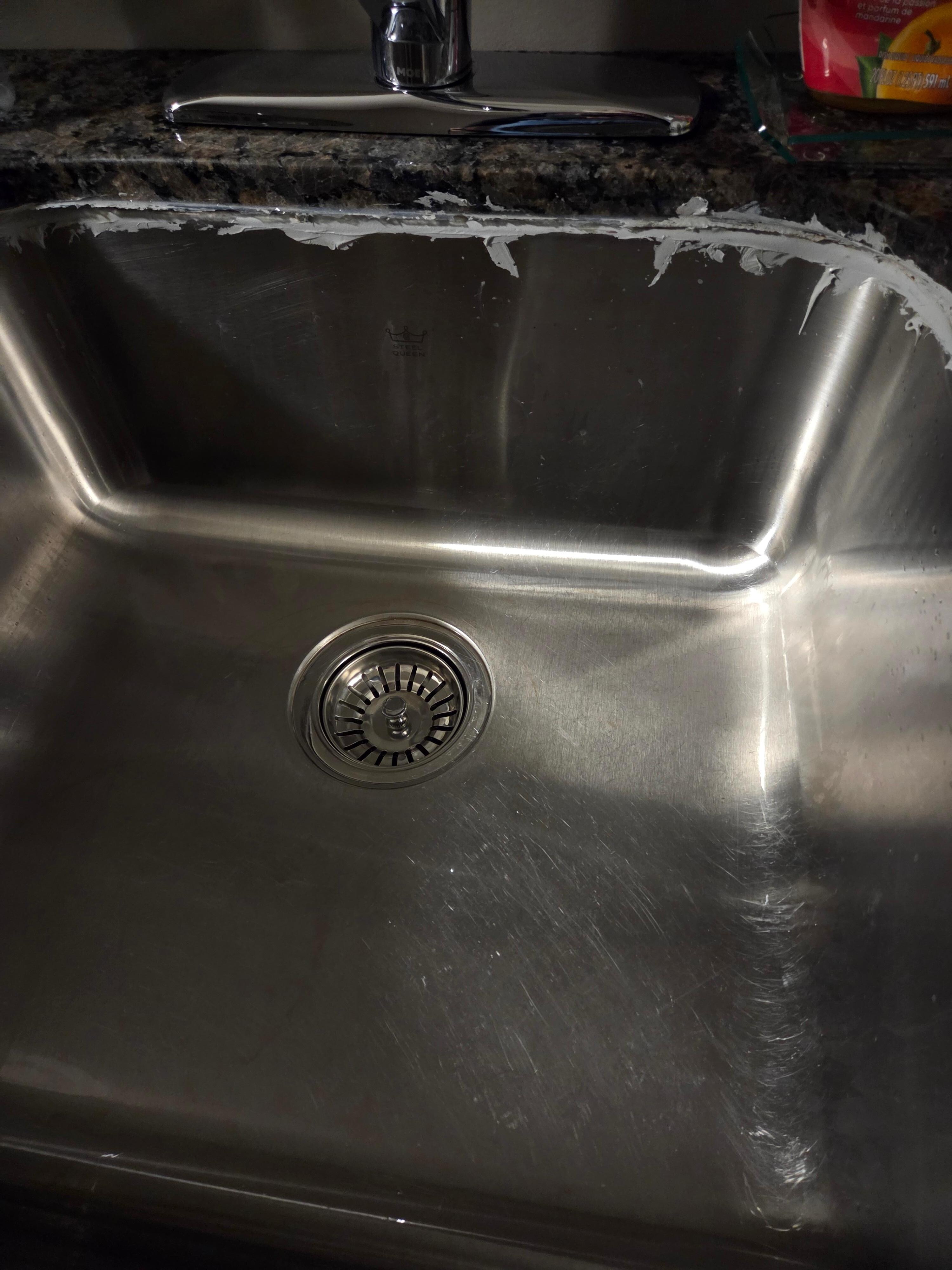 The sink was siliconed by a toddler from the looks of it.