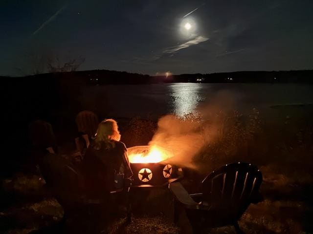 A time for reflection at the fire pit watching the moon rise over the cove.