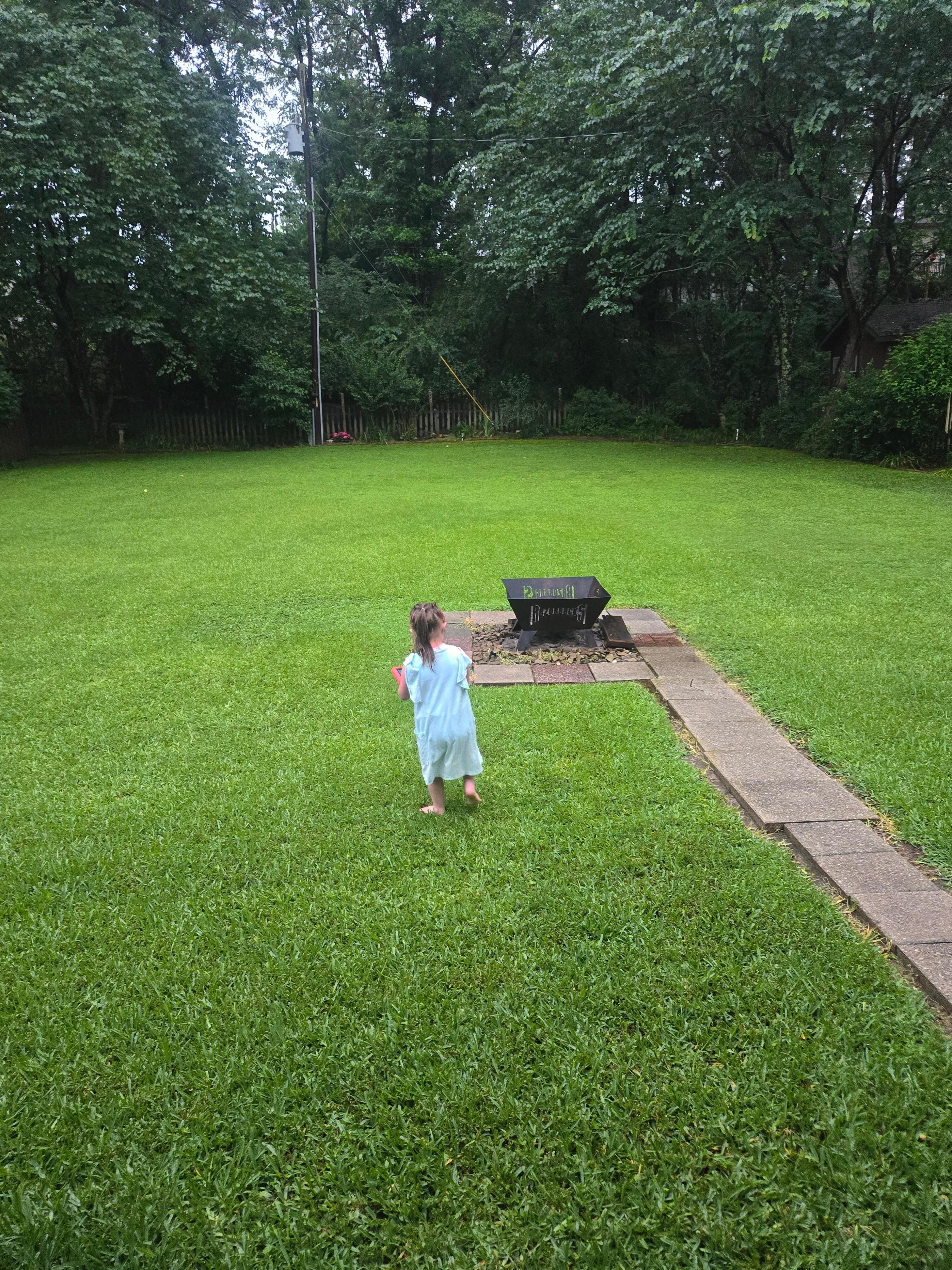 Fully fenced backyard (also bubbles and other outside toys available.) There was a BBQ, and corn hole and such beautiful porch swings and chairs too. 