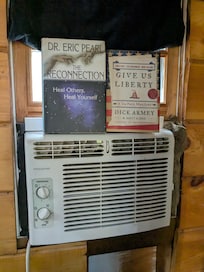 AC unit in unfinished window.