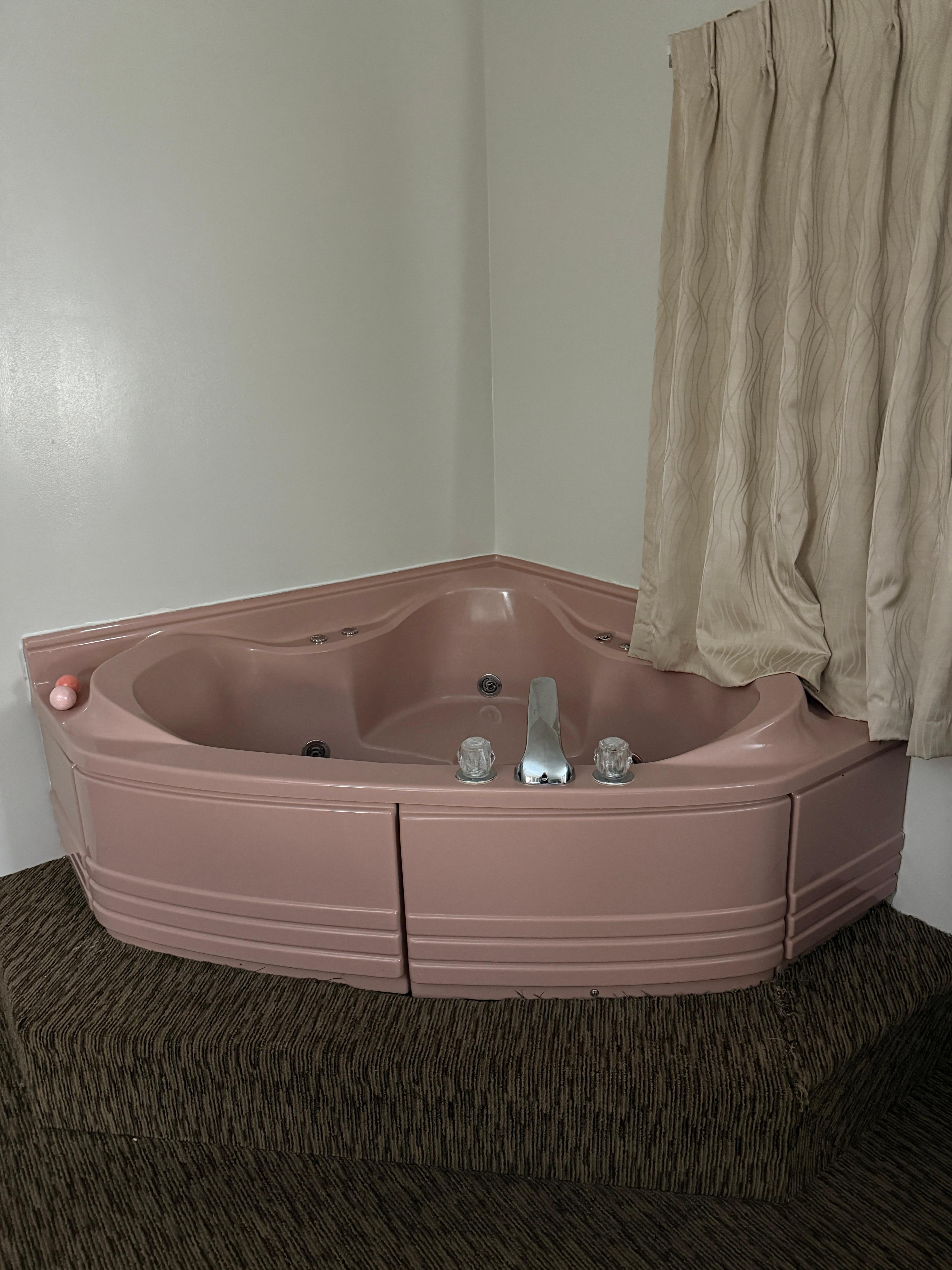 Snazzy pink jacuzzi tub 