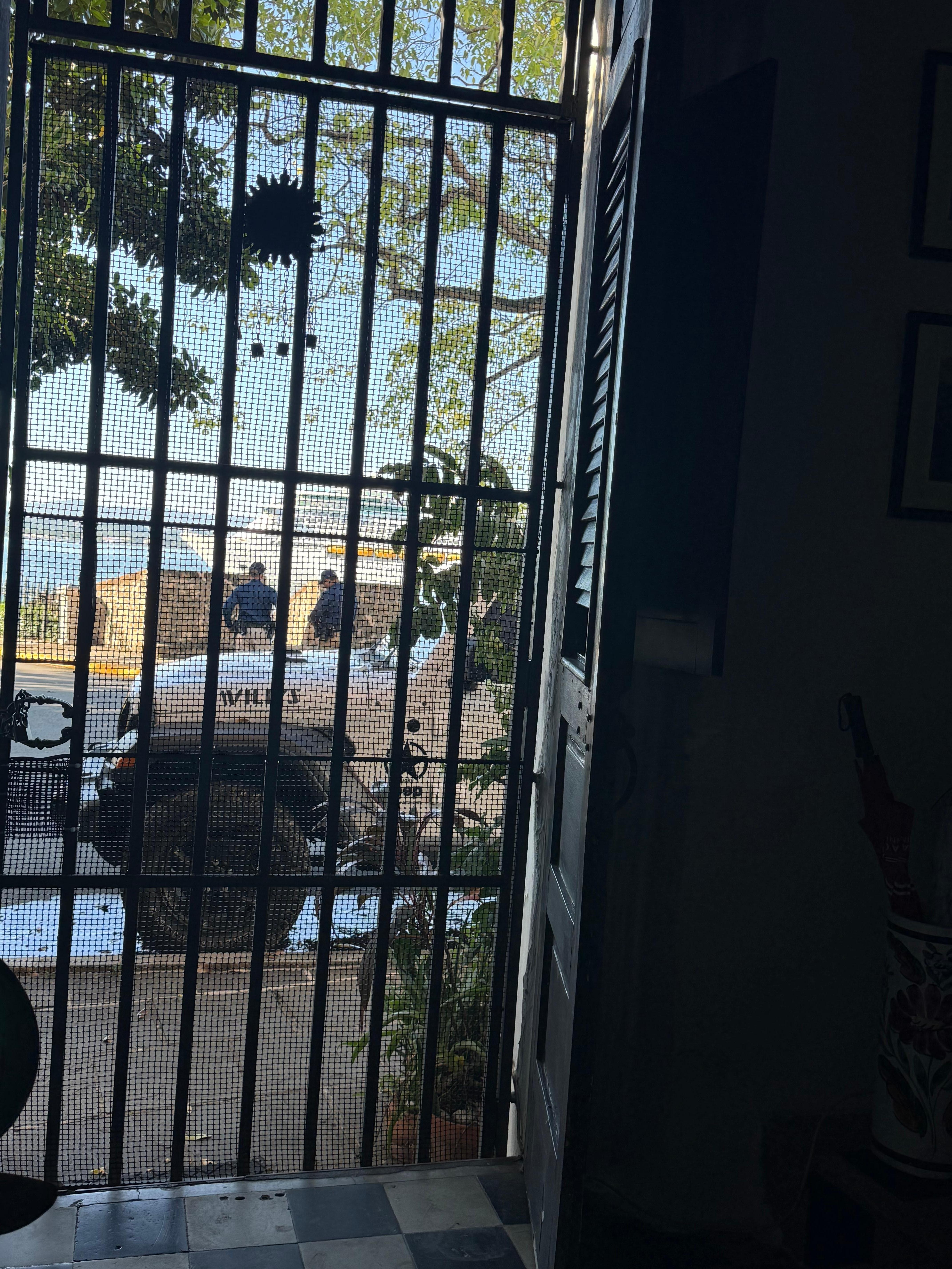 Gated front door we left padlocked but open for views and breezes