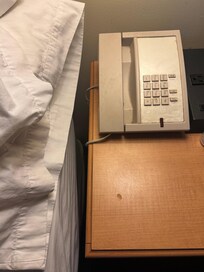 Don’t touch the phone or the night stand