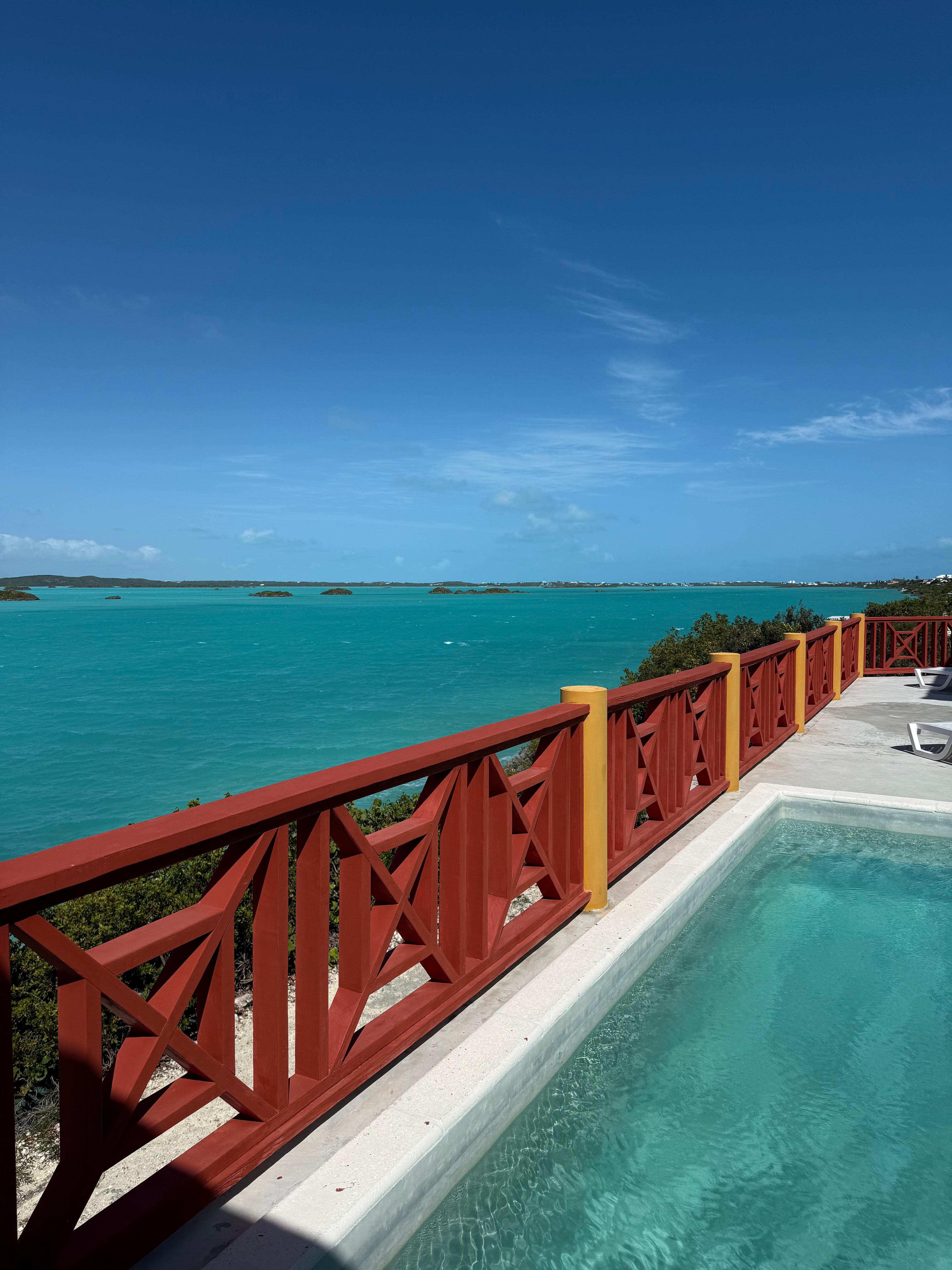 A view of the pool and Chalk Sound from the private balcony