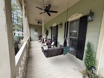 Cozy front porch to enjoy morning coffee.