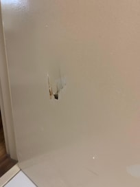 The bathroom door was kicked in.