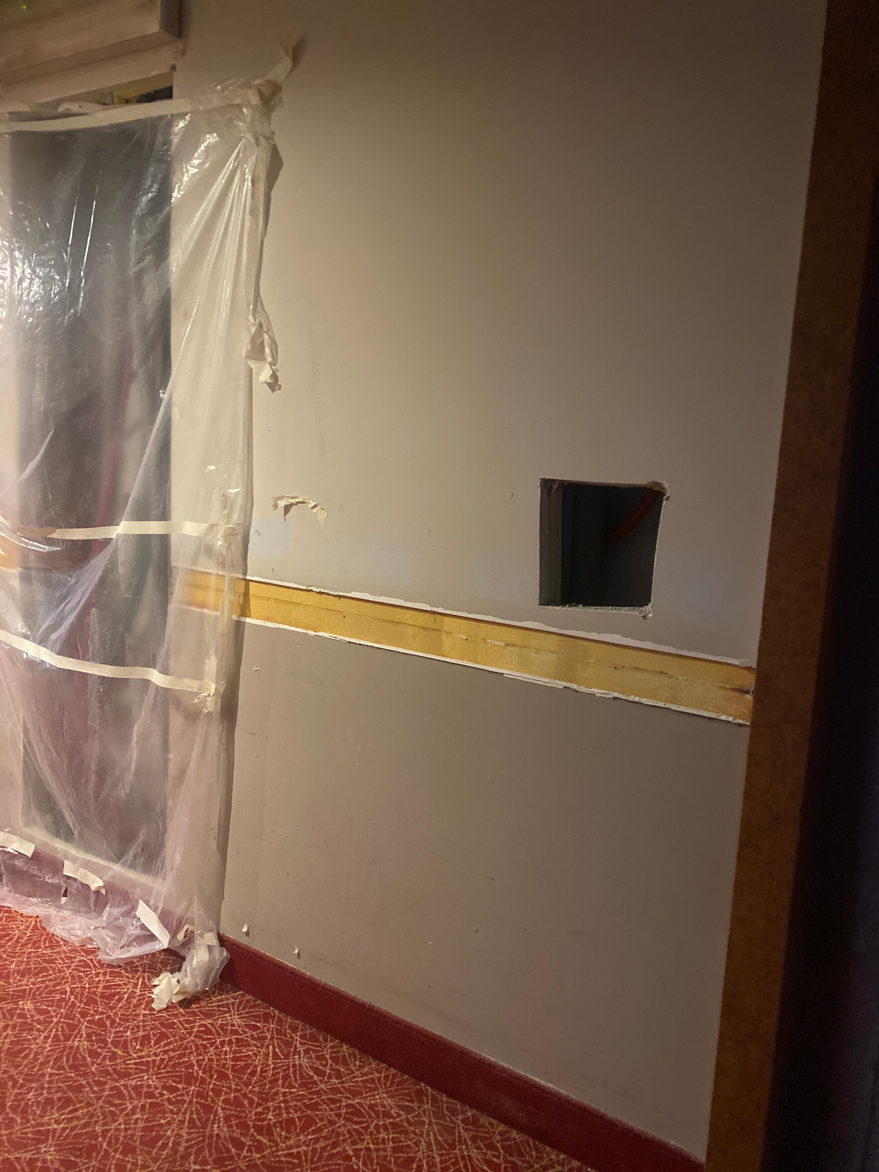 Holes in the walls in the corridors where they are selling rooms