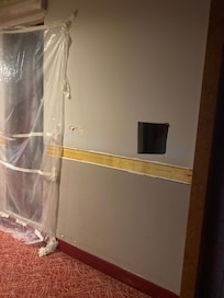 Holes in the walls in the corridors where they are selling rooms