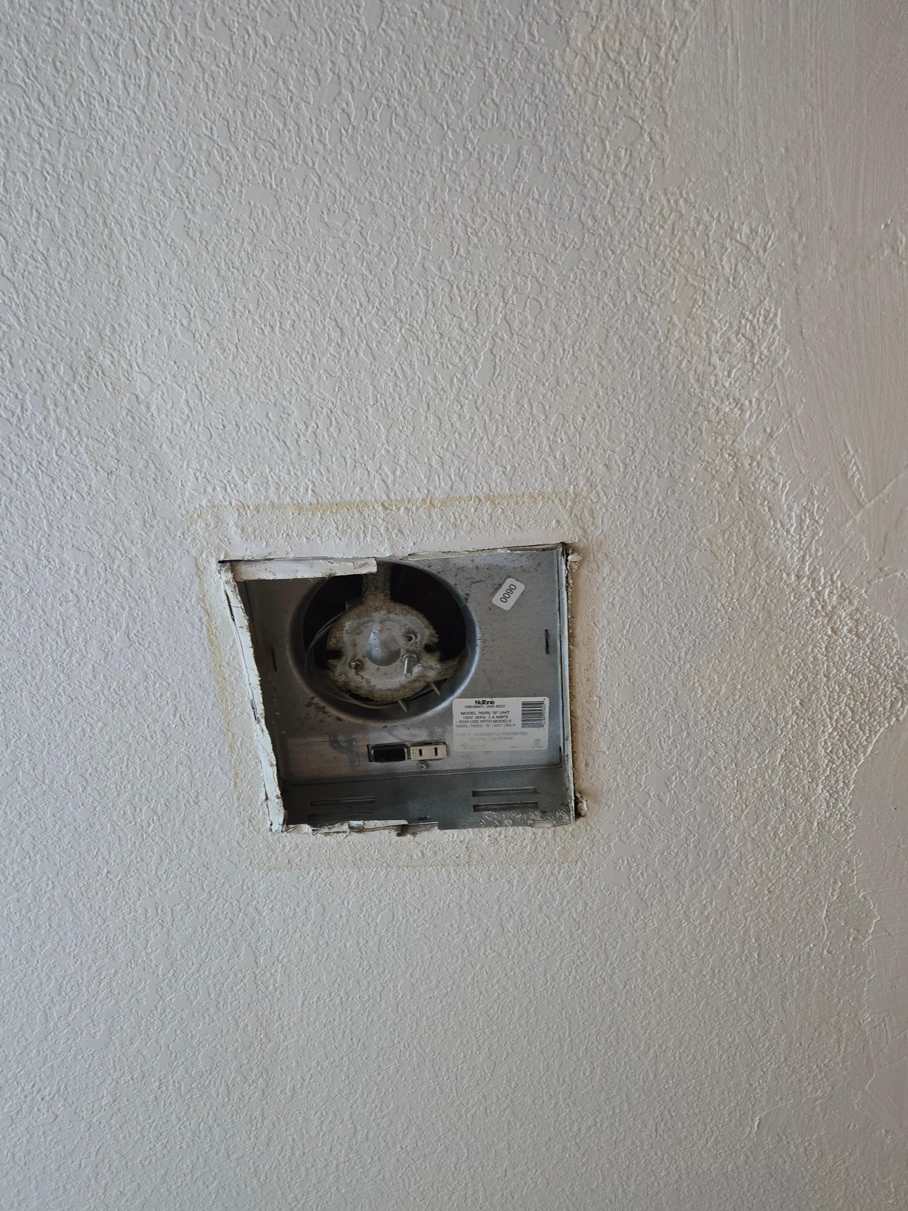 Hole where bathroom fan should have been.