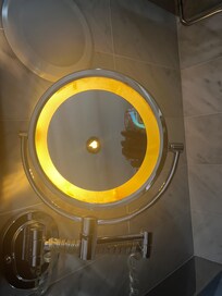 Illuminated vanity mirror can pose a serious fire hazard, not just from sunlight magnification but also because the break creates exposed wiring or faulty components, potentially causing overheating, sparking, and ignition of nearby flammable items.