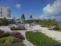 View of pool area from screened n patio.