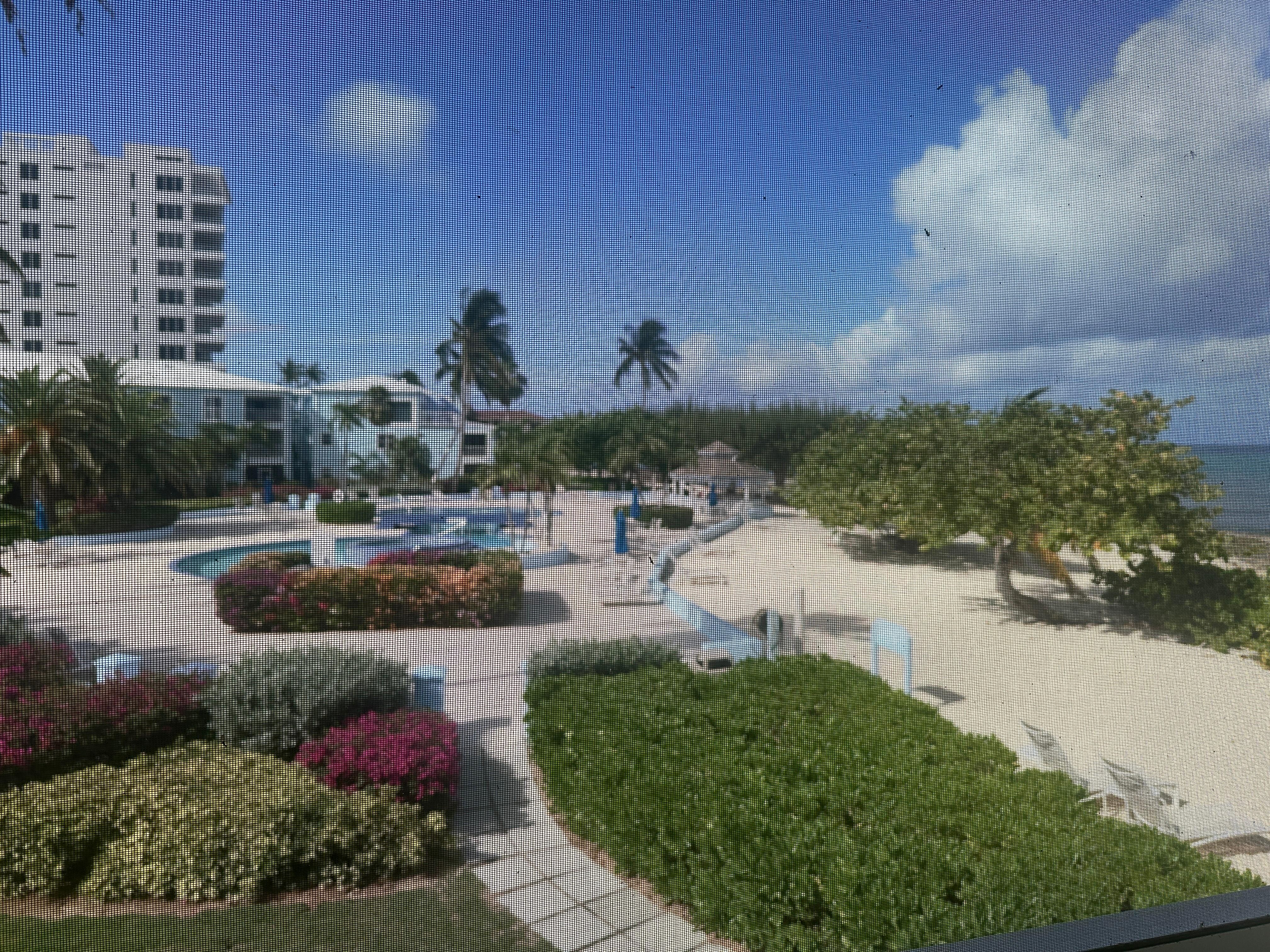 View of pool area from screened n patio. 