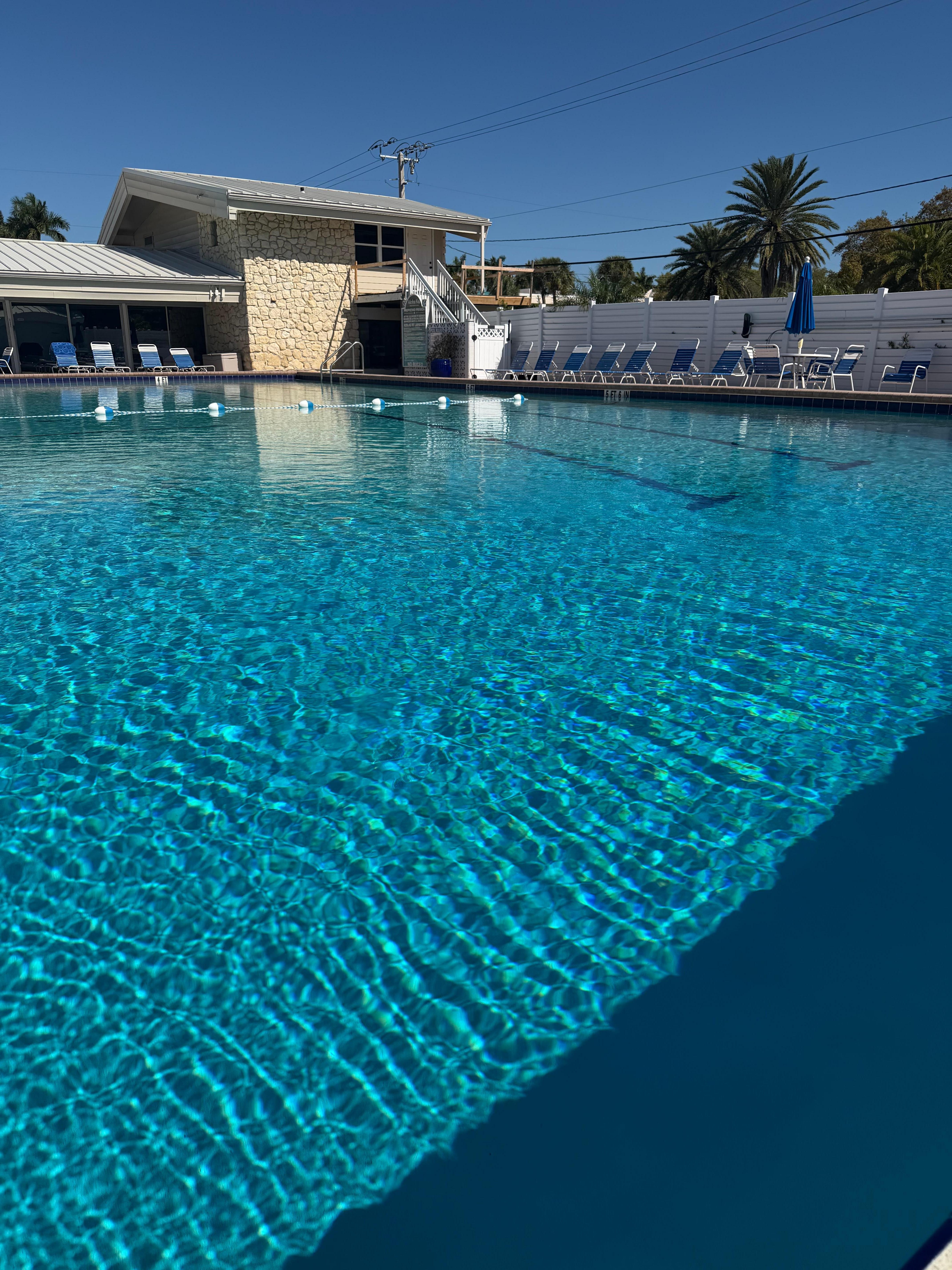 Picture of the pool that is literally right next door to the unit.