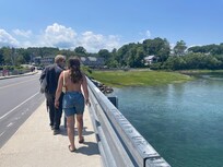 Walk across the bridge to get to beach.