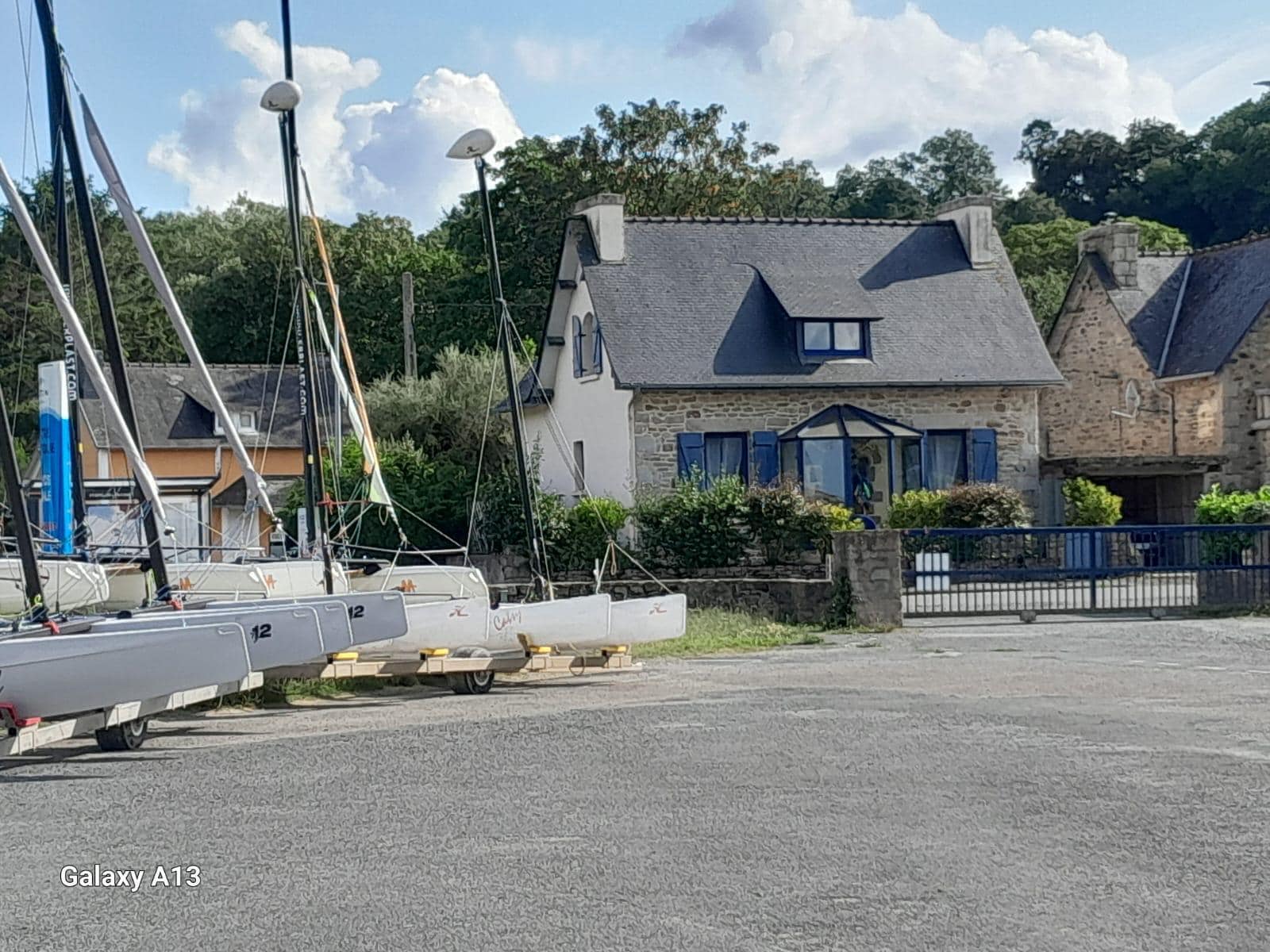 View of the house from the other side of the street, lot of the Municipal water sports center, where you can enter the beach