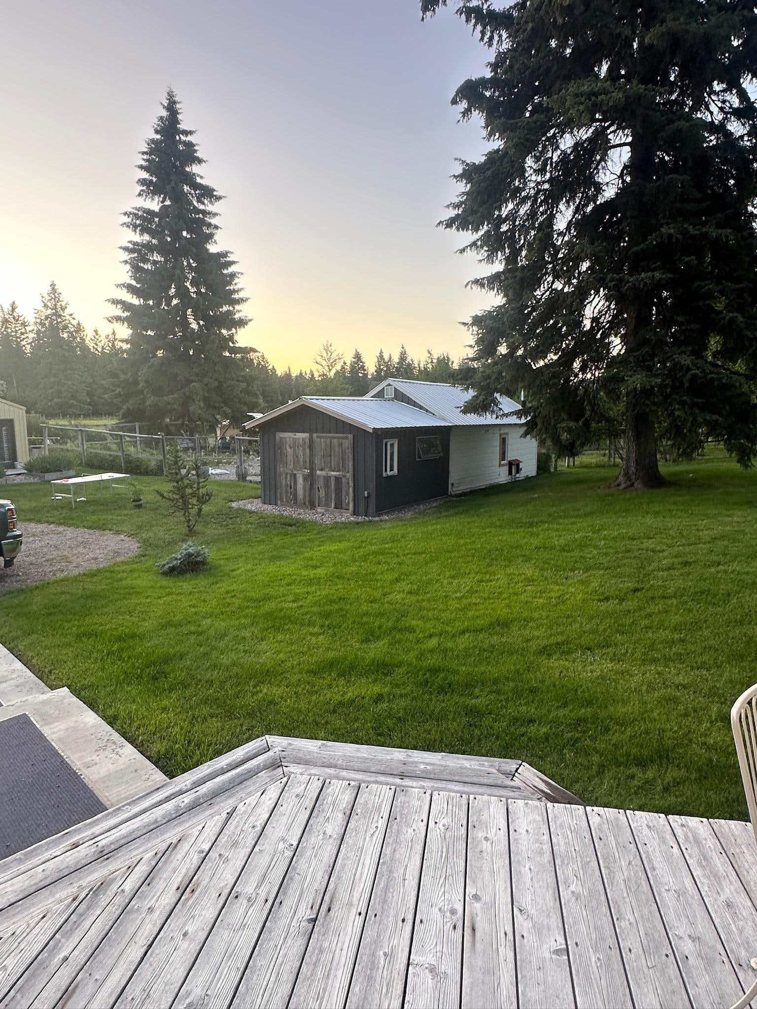 View from the deck of the Farmhouse and Log Cabin…the building is Jean’s home and garden.